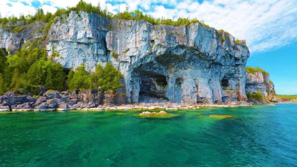 A view of limestone cliffs from turquoise water
